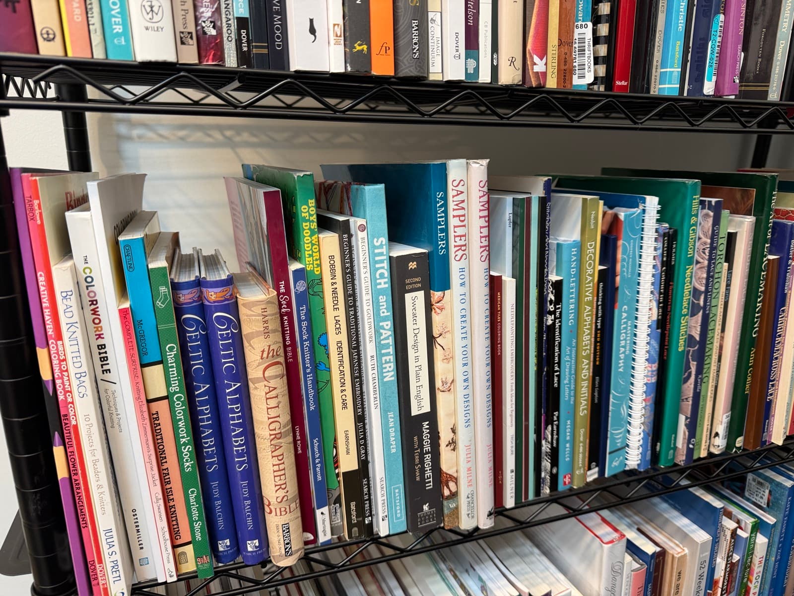 Lace, sampler, and alphabet books on the shelf